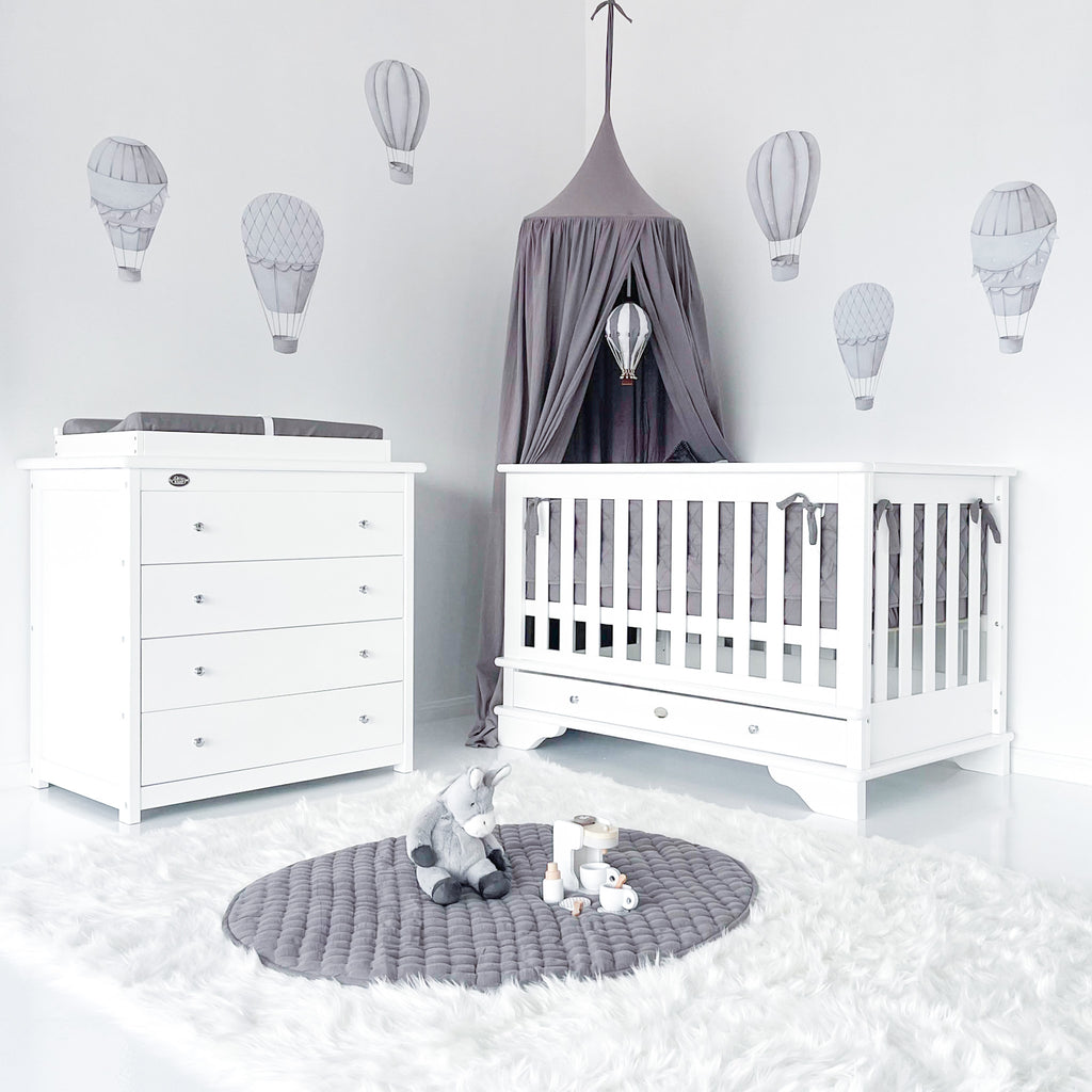 Contemporary cot with chest of 4 drawers and change mat with timber frame