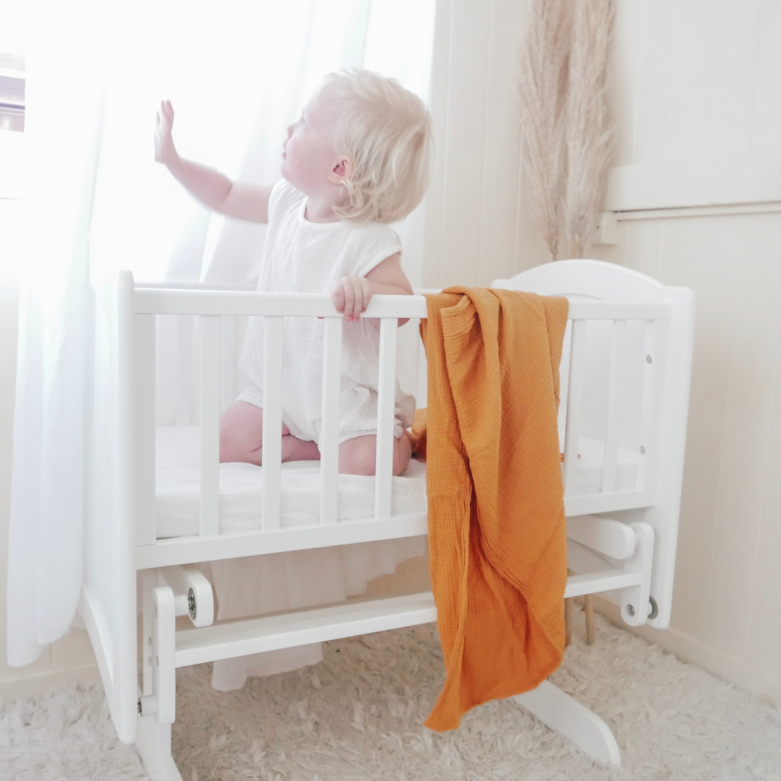 Rocking Cradle with Toddler Demonstrating Strength