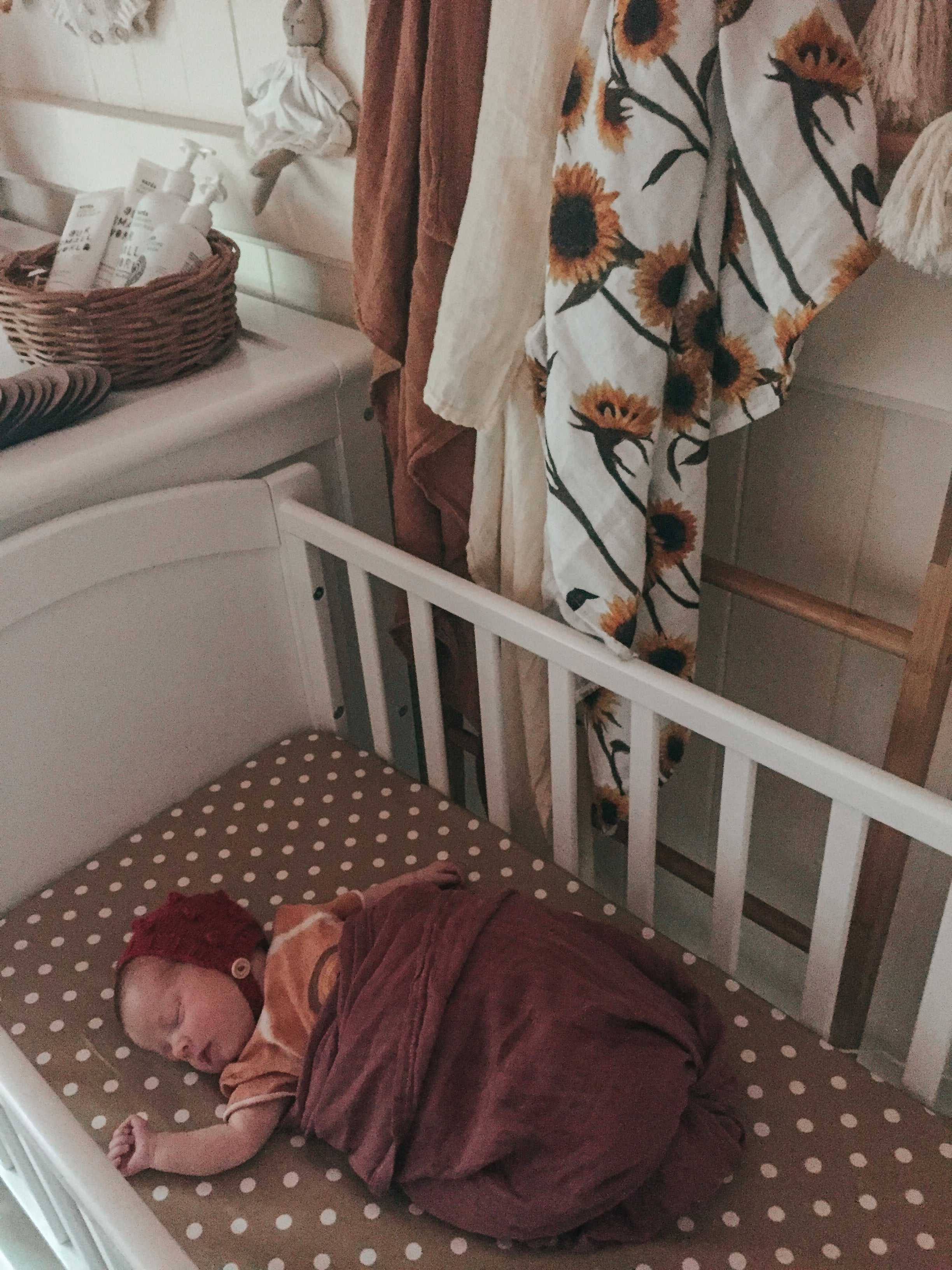 Newborn Sleeping in Rocking Cradle